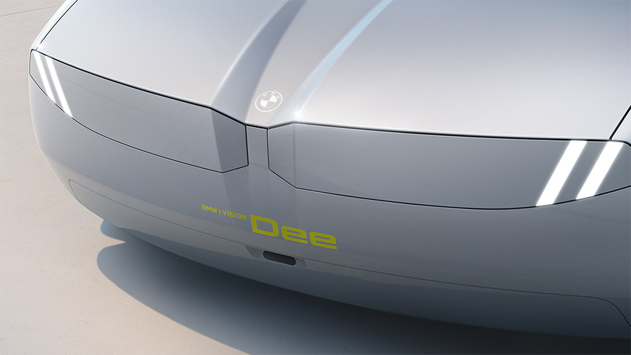 Os faróis e a grade curva da BMW compõem uma superfície uniforme com linhas gráficas.